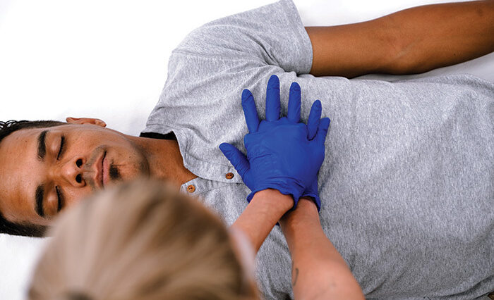 Health Professional Teaching How To Perform CPR